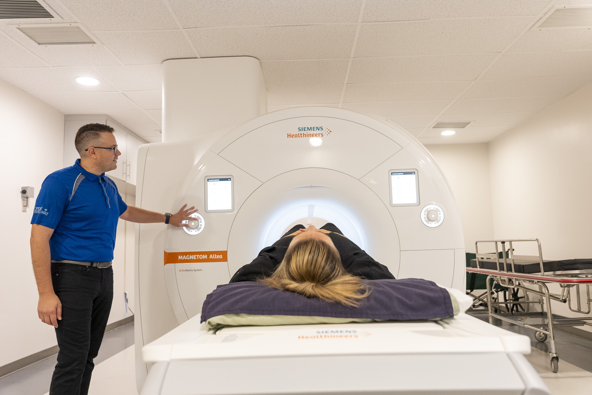 man helping conduct an MRI