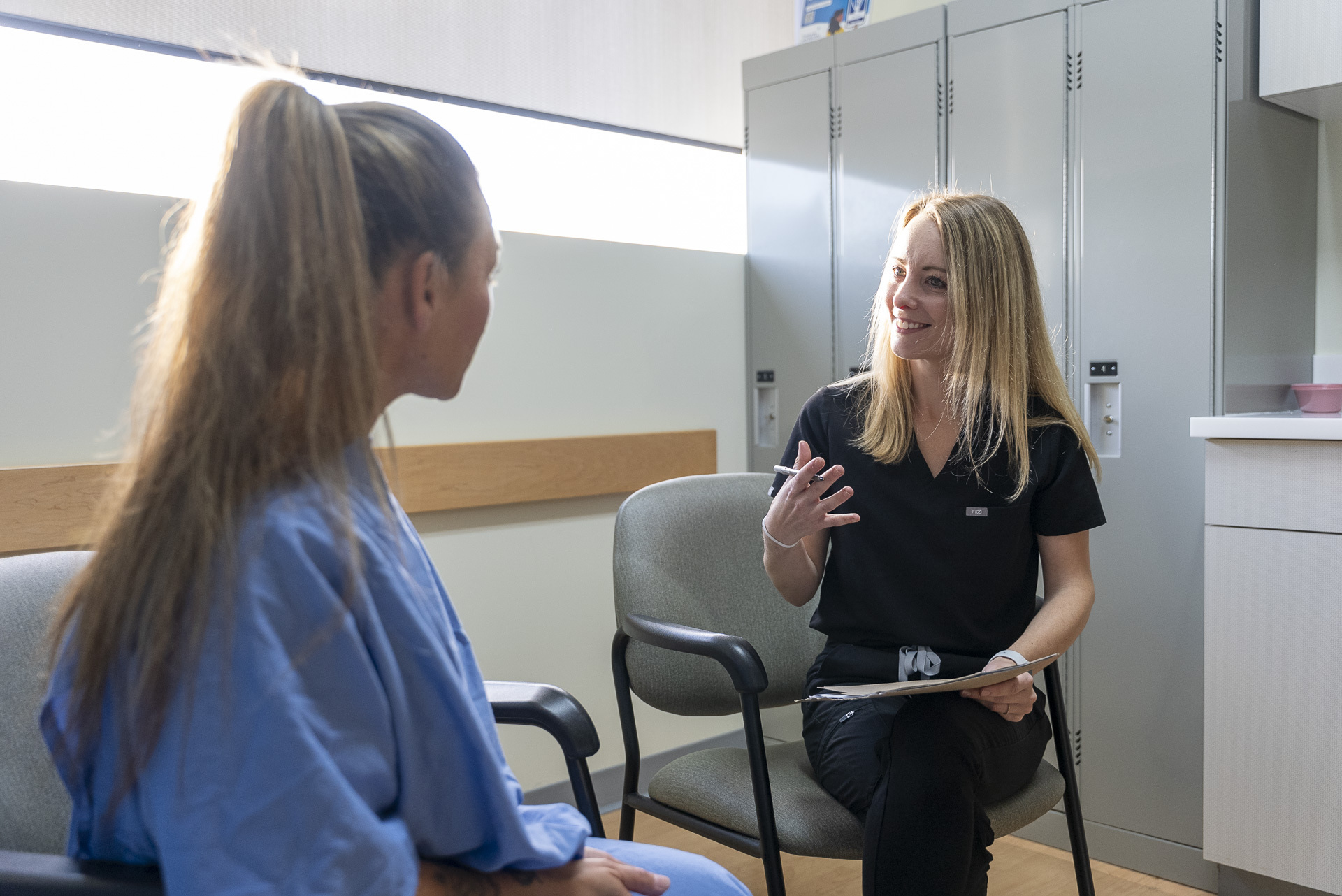 woman giving a consultation on an MRI